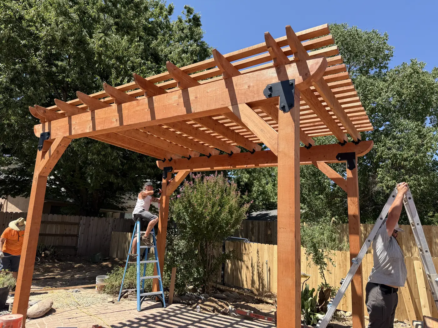 Our crew building a wood pergola over a patio