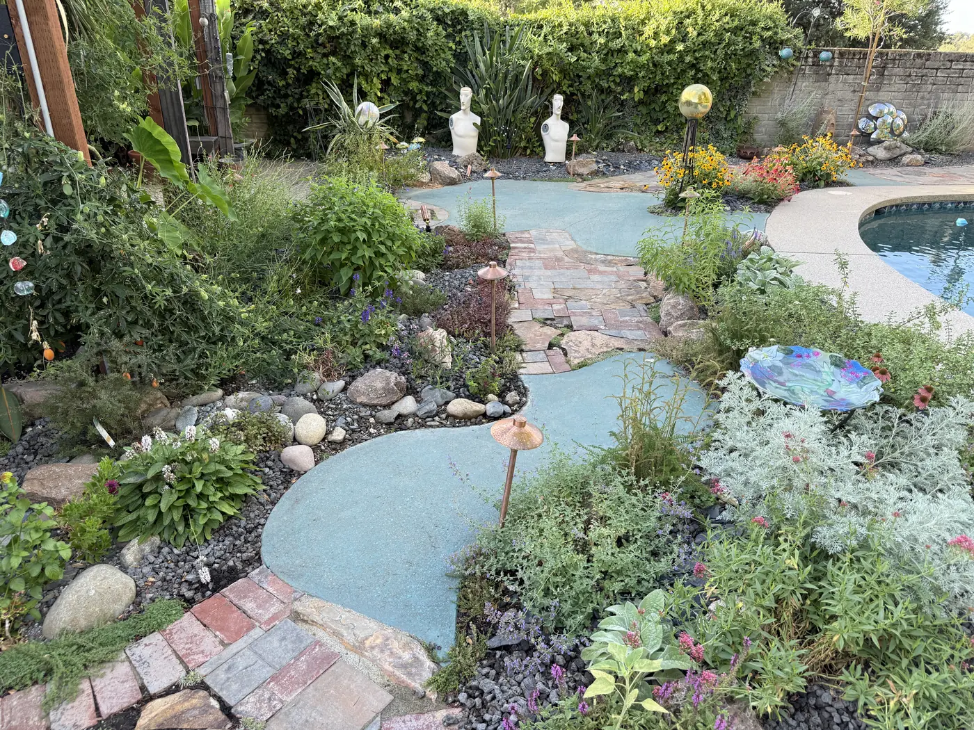 Garden beds of perennials beside a pool